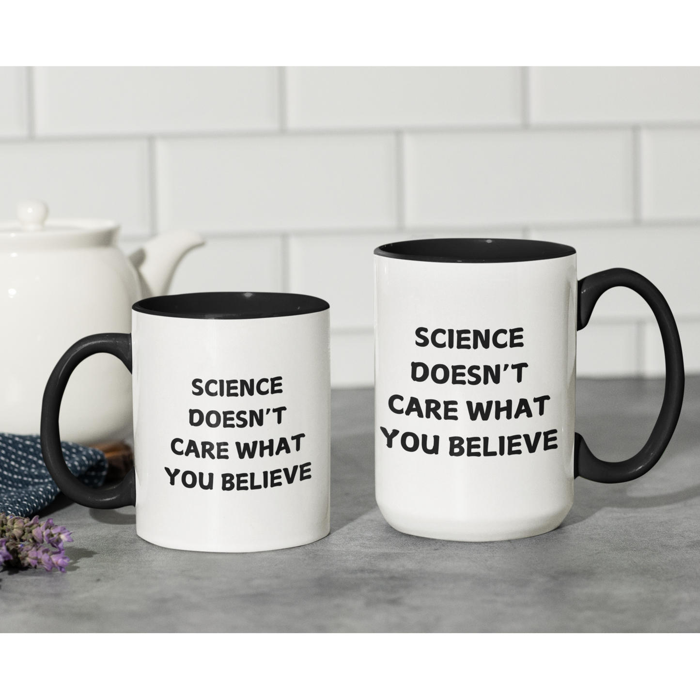 11 & 15 oz stylish ceramic coffee mug with a bold black handle and matching black interior, creating a sleek contrast against its glossy white exterior. The front of the mug features a powerful statement in all-capital black letters: "SCIENCE DOESN'T CARE WHAT YOU BELIEVE." The font is clean and impactful, making the message stand out.