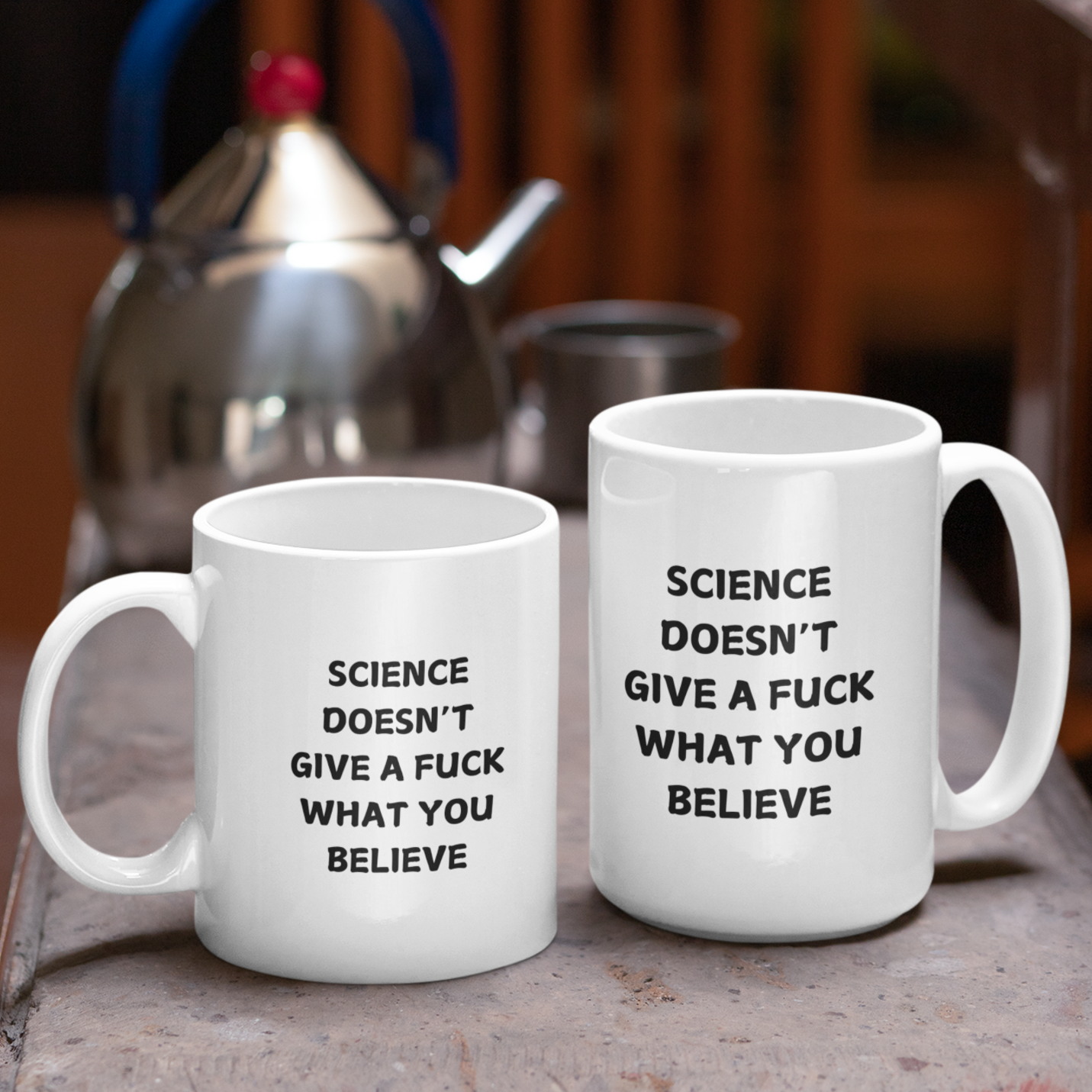 11 & 15 oz white ceramic coffee mug featuring bold black text that reads, "SCIENCE DOESN'T GIVE A F*CK WHAT YOU BELIEVE." The design uses an all-caps, sans-serif font with a slightly playful, bold look. Ideal for science enthusiasts, skeptics, and anyone who appreciates blunt humor with a dose of scientific truth.