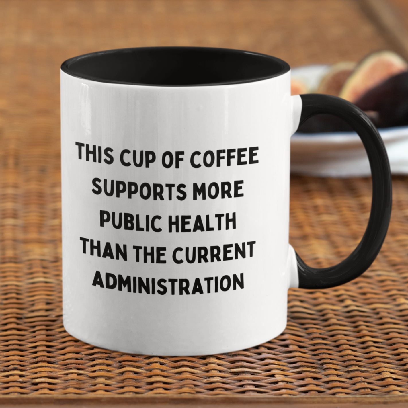 11 oz white ceramic coffee mug with a sleek black handle and black interior. The mug features a bold, humorous message in black, all-caps text that reads: "THIS CUP OF COFFEE SUPPORTS MORE PUBLIC HEALTH THAN THE CURRENT ADMINISTRATION." Perfect for health professionals, activists, or anyone with a sharp sense of humor and passion for public health.