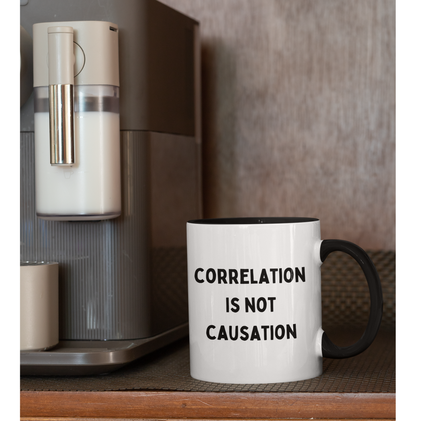 11 oz ceramic coffee mug featuring a bold and minimalist design. The mug has a white glossy finish with a contrasting black handle and black interior. On the front, it displays the phrase "CORRELATION IS NOT CAUSATION" in all-caps, black, sans-serif font, centered across three lines.