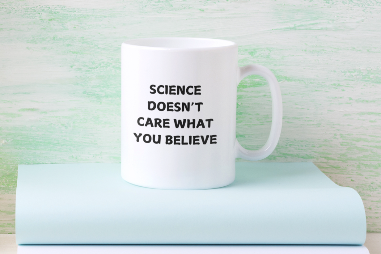 11 oz white ceramic coffee mug featuring a bold, black printed message that reads: "SCIENCE DOESN'T CARE WHAT YOU BELIEVE." The text is centered on the front of the mug, making it easy to read while holding it. The mug has a smooth glossy finish, a comfortable C-shaped handle, and a durable design perfect for everyday use. Ideal for science enthusiasts, skeptics, and anyone who appreciates evidence-based thinking.