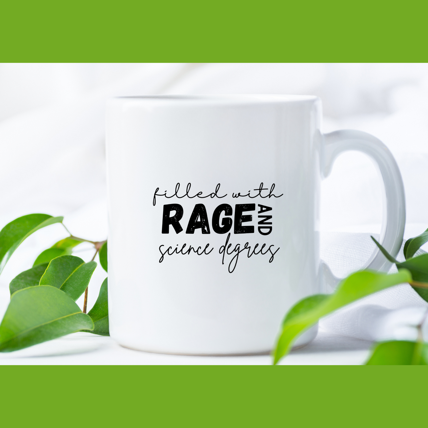 11 oz Close-up of a white ceramic coffee mug that features a bold and playful typography design that reads: "filled with RAGE AND science degrees." The words "RAGE AND" are in bold, uppercase letters, while the rest of the text is in a casual, handwritten script. Ideal for scientists, academics, or STEM enthusiasts.