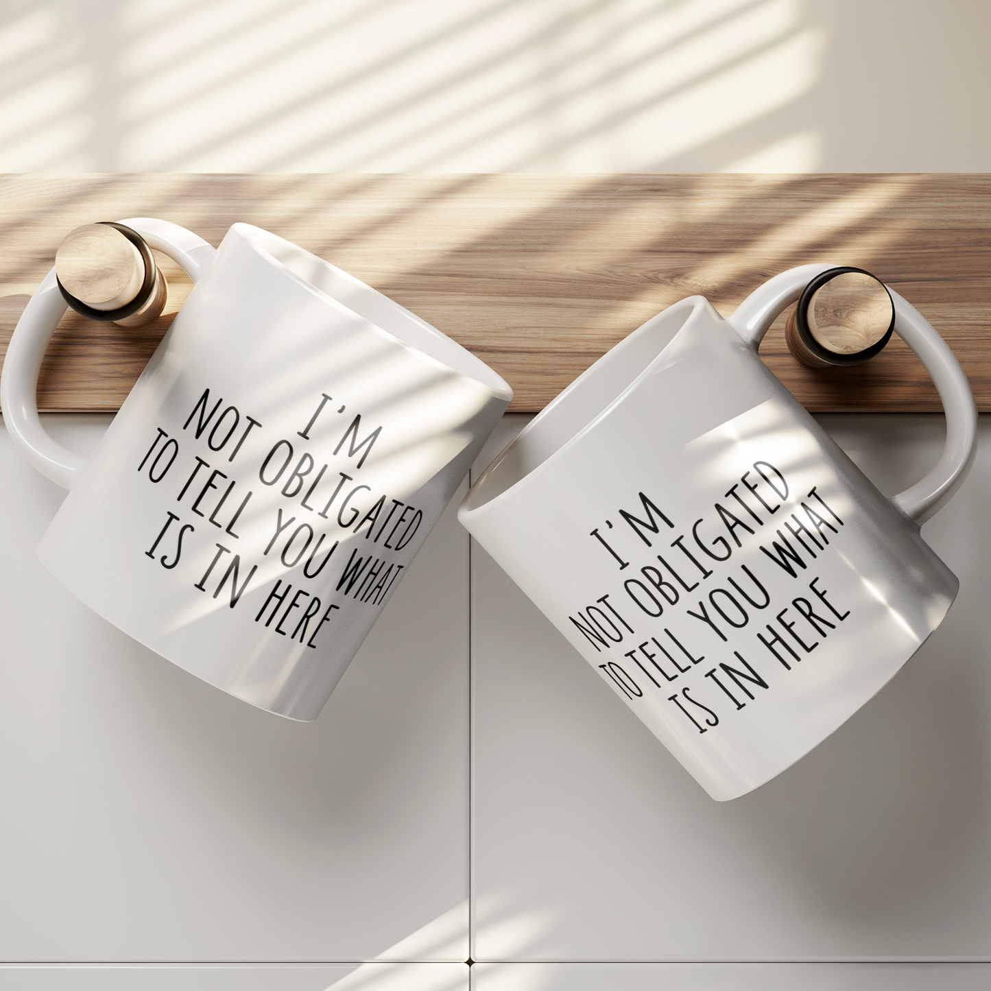 Simple yet impactful 11 oz white mug featuring the witty statement "I'M NOT OBLIGATED TO TELL YOU WHAT IS IN HERE" in a clear black font. Perfect for those with a dry wit and a desire for a bit of beverage privacy.