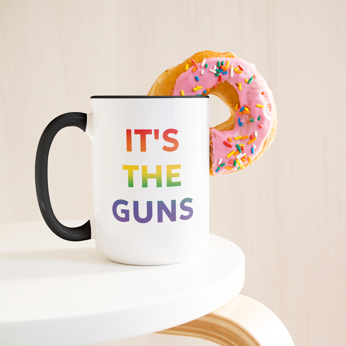 Its_The_Guns_Coffee_Mug_Supporting_Gun__Lifestyle_Donut_LH_Mockup.png