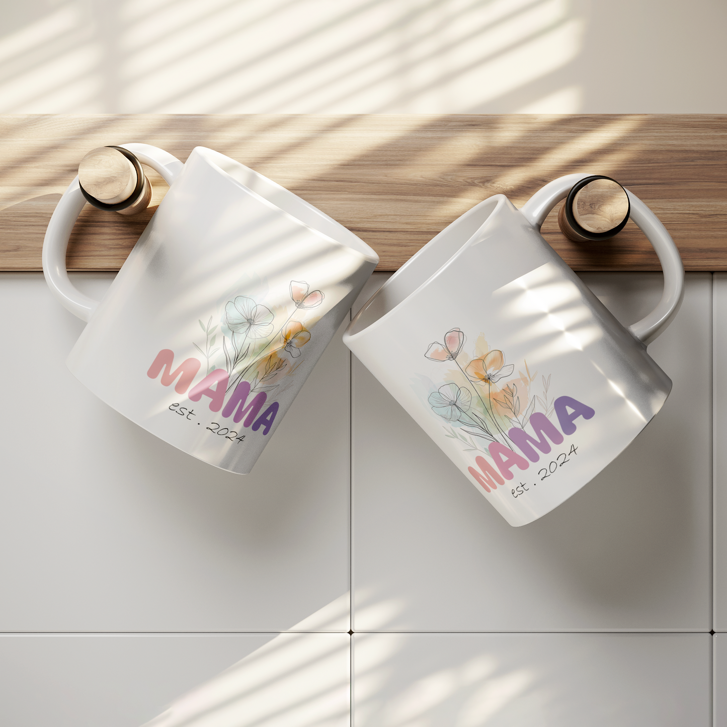 Charming 11 oz white ceramic mug featuring a soft watercolor-style floral bouquet and the word “MAMA” in bold, colorful letters transitioning from pink to purple. Beneath the floral artwork, the text reads “est. 2024” in a delicate handwritten font. Perfect gift for new moms or a Mother’s Day surprise celebrating motherhood’s newest chapter.