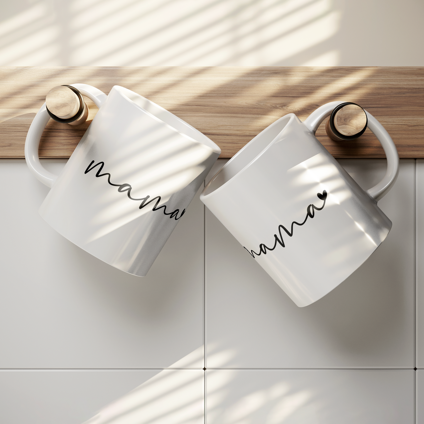 Sleek 11 oz white ceramic coffee mug featuring a minimalist black handwritten-style script that reads “mama” with a small heart accent at the end. The mug has a smooth, glossy finish and a large, easy-grip handle. Perfect for gifting to moms who appreciate simple, modern design and a daily reminder of their cherished role. Ideal for Mother’s Day, birthdays, or everyday appreciation.
