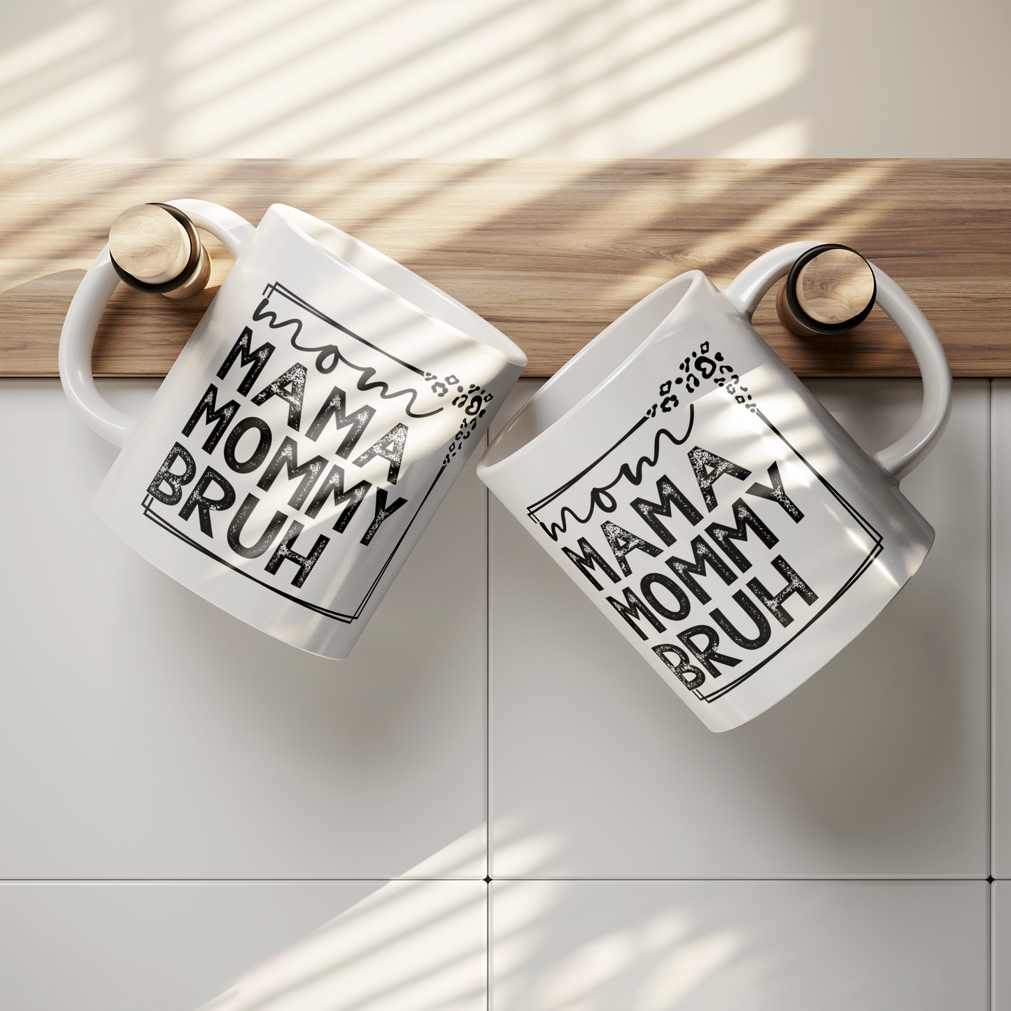 11 oz white mug displaying a playful design that reads "mom MAMA MOMMY BRUH" in black, framed with leopard print details. A funny gift for moms with a sense of humor.