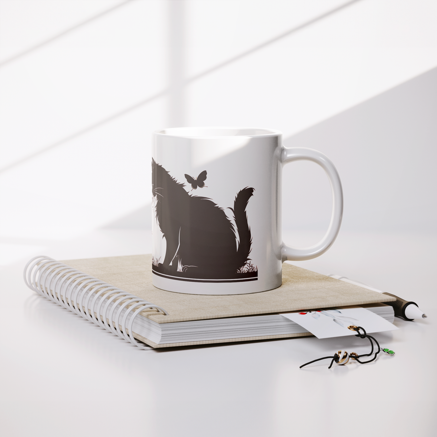 Charming white ceramic coffee mug featuring a heartwarming black silhouette design of a proud Papa cat watching over four playful kittens in a grassy setting. A butterfly flutters above, adding a whimsical touch to the peaceful scene. The wraparound artwork is beautifully printed across the surface, making it a perfect gift for cat Dad, feline lovers, or anyone who enjoys cozy mornings with a touch of pet-inspired charm. Durable, high-quality mug ideal for daily use or gifting.