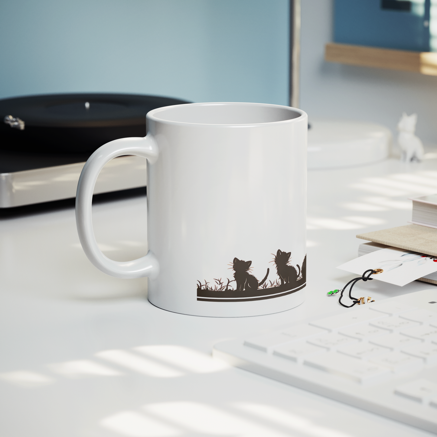 Charming white ceramic coffee mug featuring a heartwarming black silhouette design of a proud Papa cat watching over four playful kittens in a grassy setting. A butterfly flutters above, adding a whimsical touch to the peaceful scene. The wraparound artwork is beautifully printed across the surface, making it a perfect gift for cat Dad, feline lovers, or anyone who enjoys cozy mornings with a touch of pet-inspired charm. Durable, high-quality mug ideal for daily use or gifting.