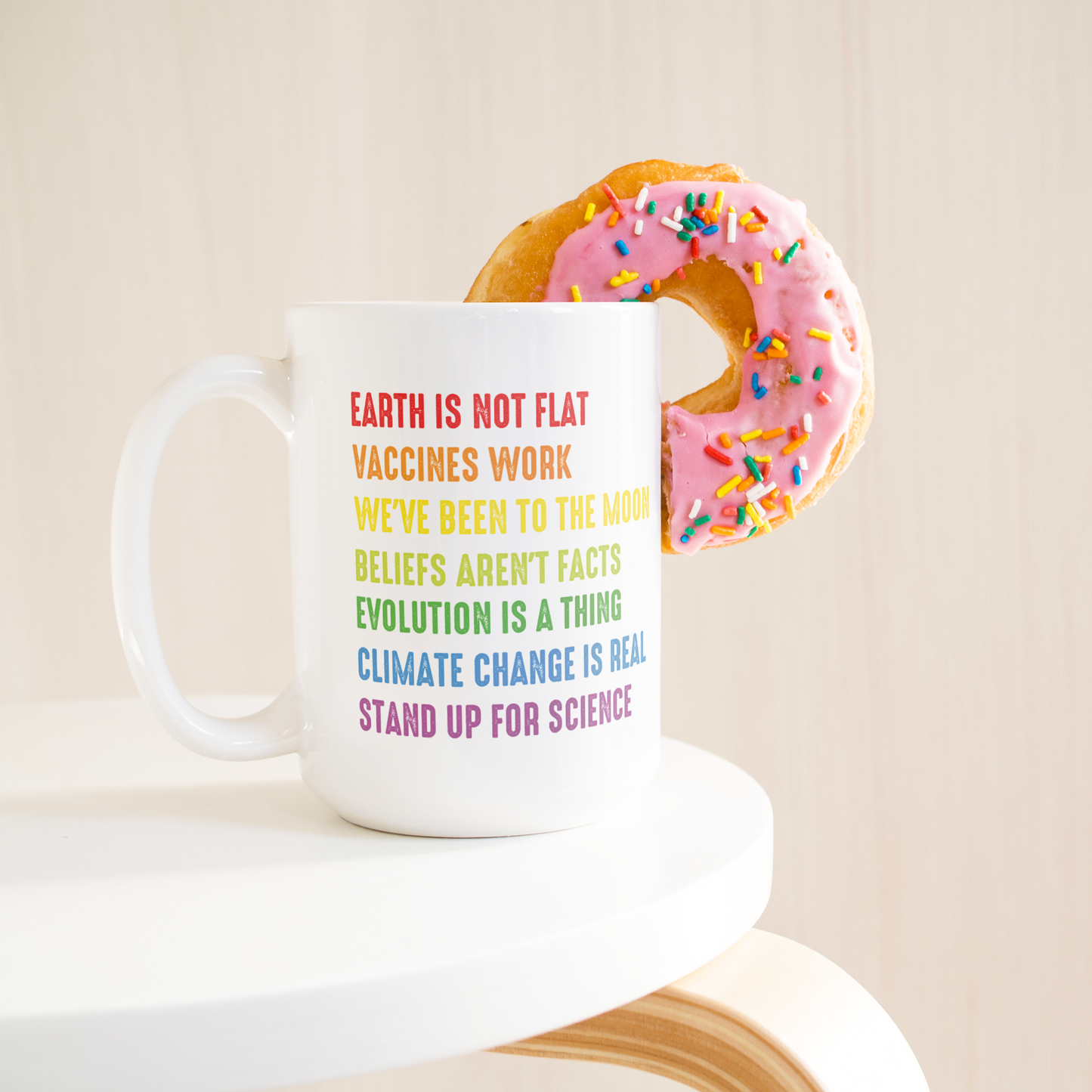 Science_Coffee_Mug__Stand_Up_for_S_15ozWhiteMugLifetsyleDonutLH_Mockup.png