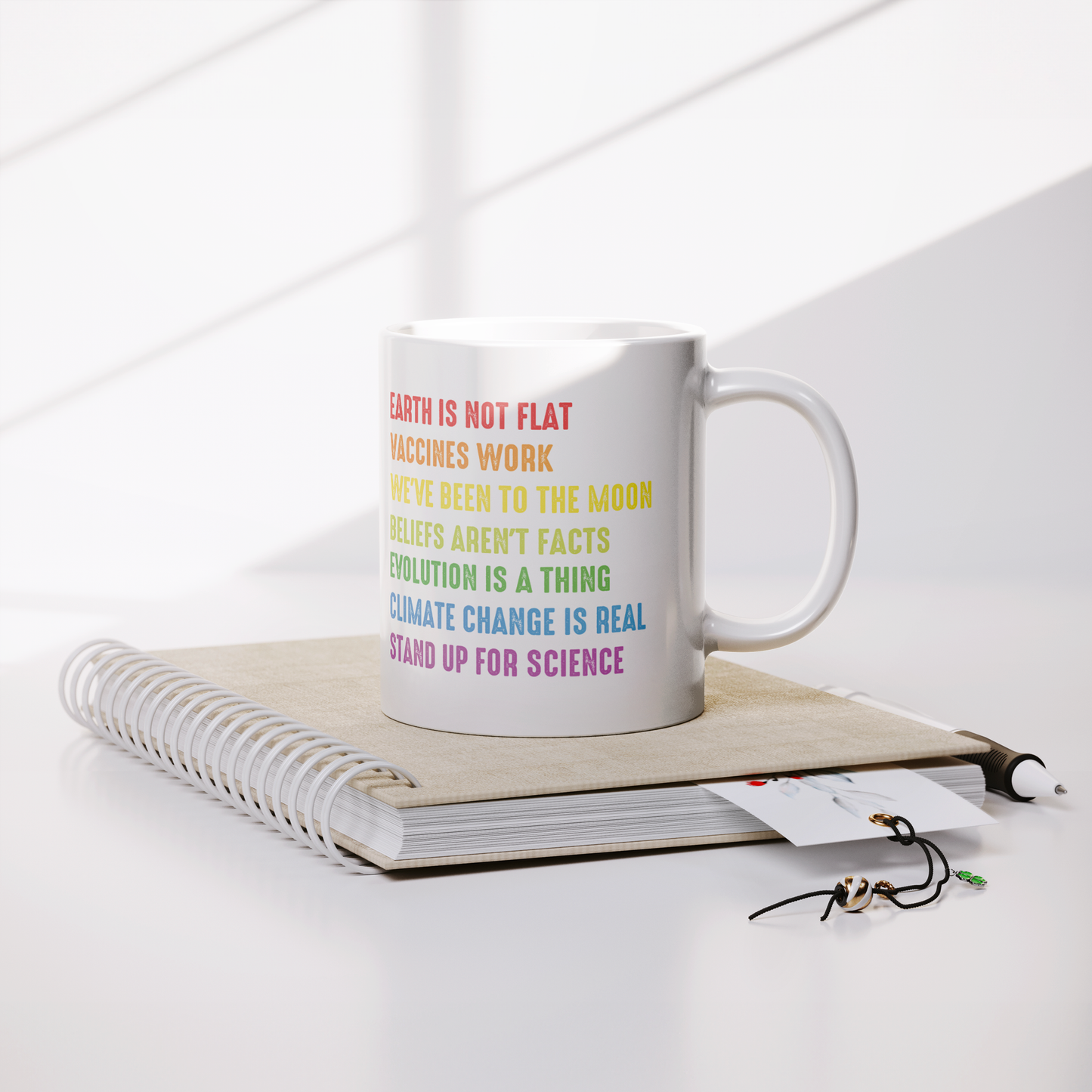 Science_Coffee_Mug__Stand_Up_for_S_Lifestyle_Notebook_Mockup.png
