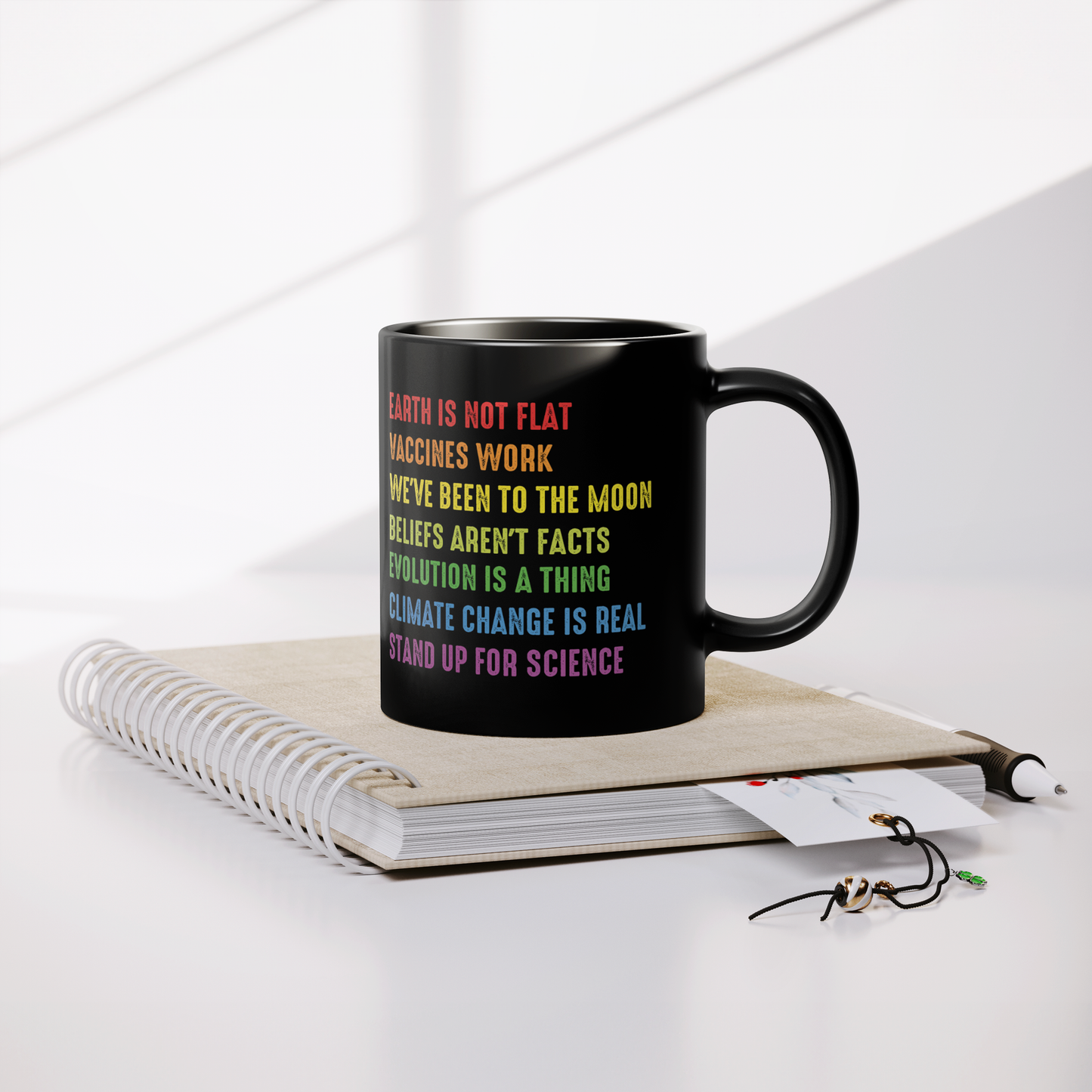Science_Coffee_Mug__Stand_Up_for_S_Lifestyle_Notebook_Mockup.png