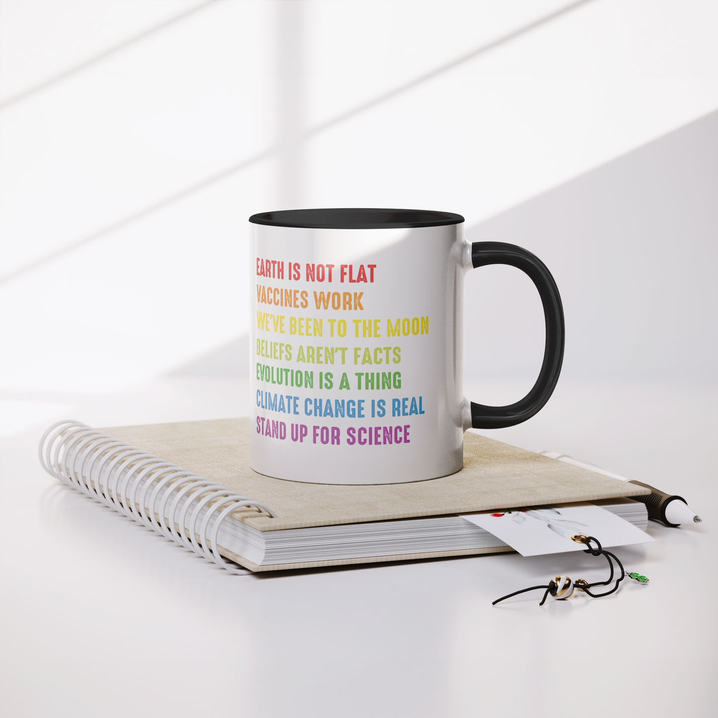 Science_Coffee_Mug__Stand_Up_for_S_Mug_Lifestyle_Notebook_Mockup.png