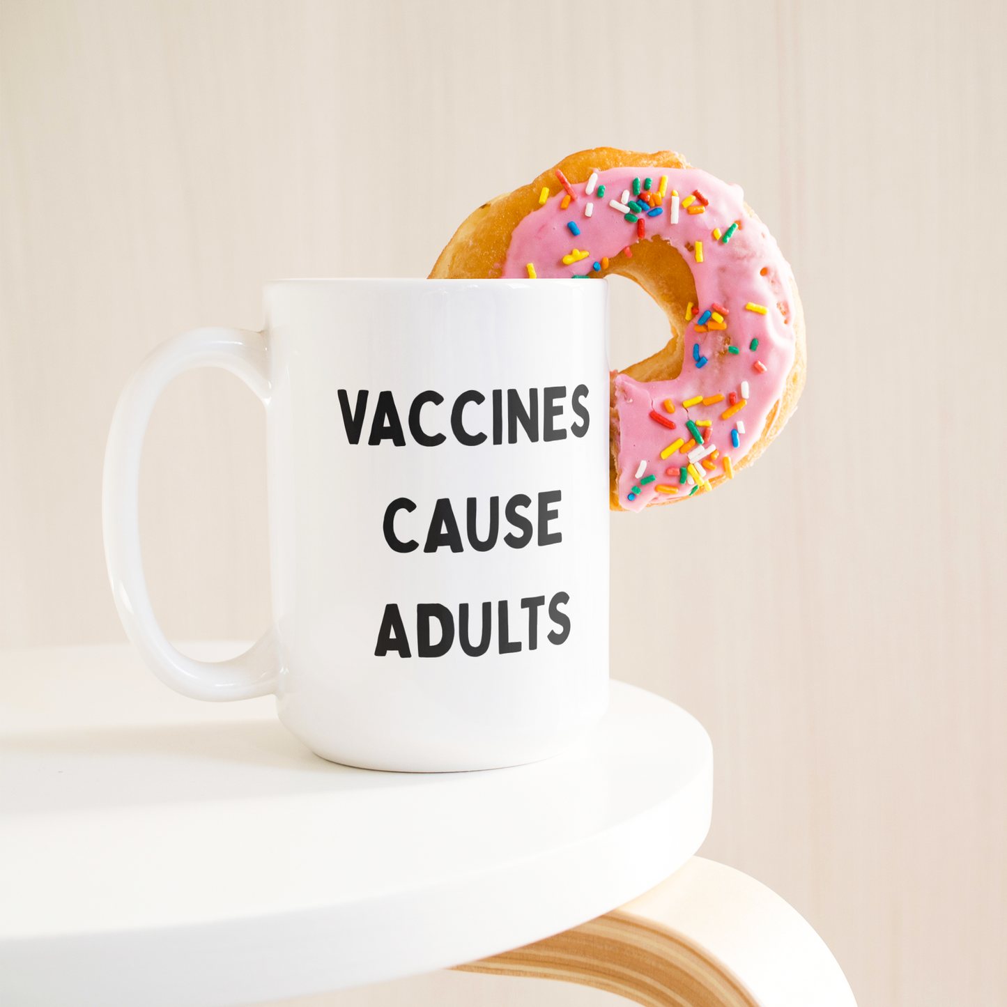 Science_Coffee_Mug__Vaccines_Cause_15ozWhiteMugLifetsyleDonutLH_Mockup.png