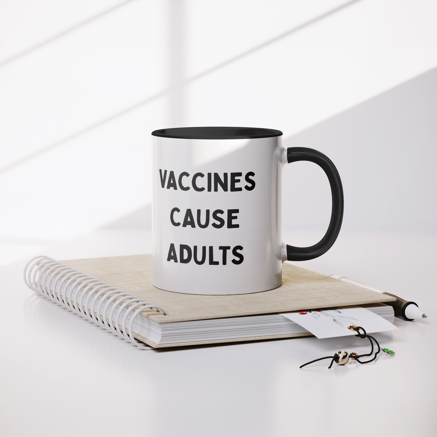 Science_Coffee_Mug__Vaccines_Cause_Mug_Lifestyle_Notebook_Mockup.png