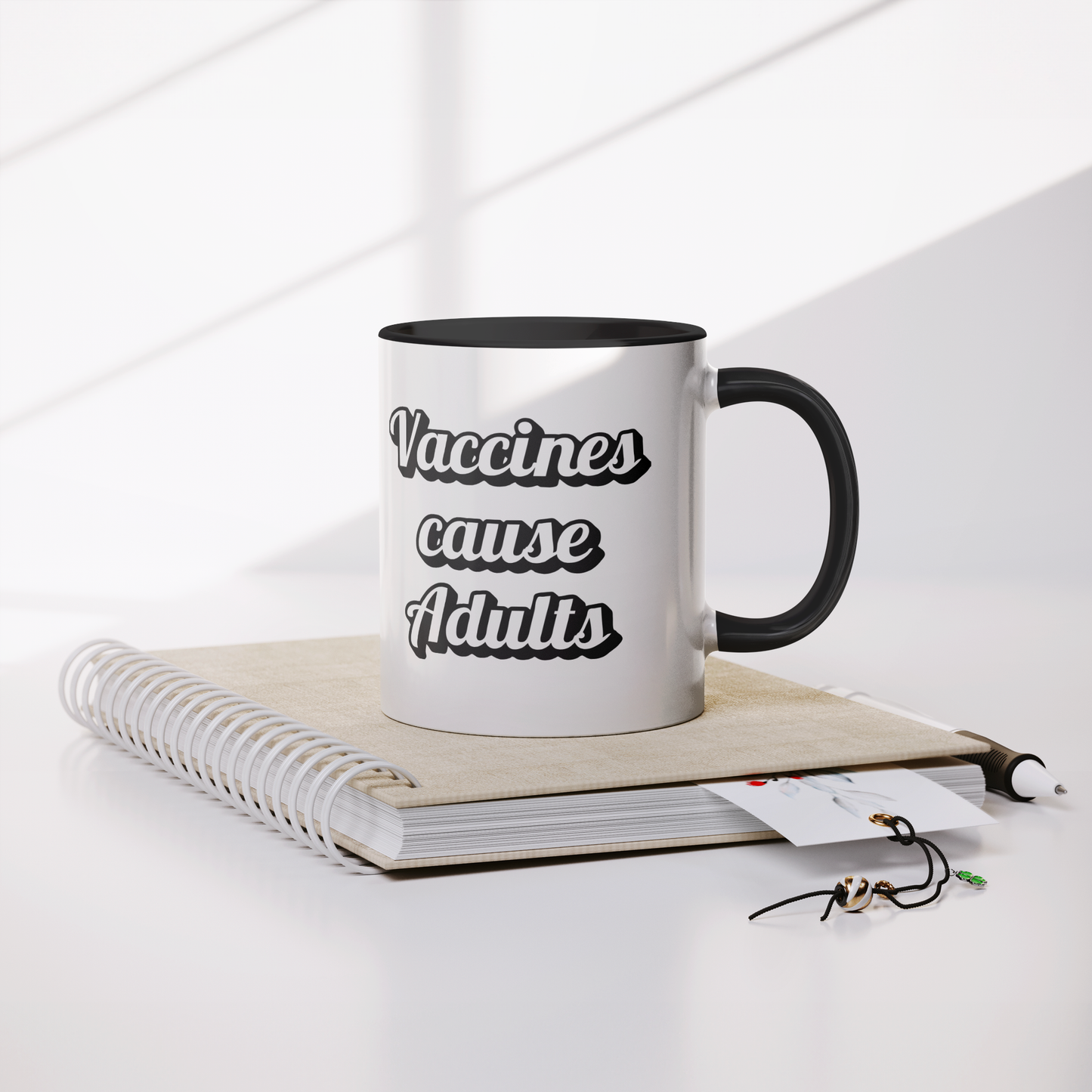 Science_Coffee_Mug__Vaccines_Cause_Mug_Lifestyle_Notebook_Mockup.png