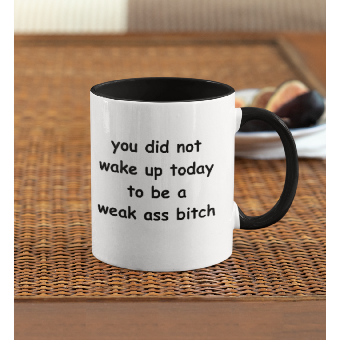 Stylish 11 oz two-tone ceramic coffee mug featuring a bold motivational message printed in playful black text. The phrase reads, “you did not wake up today to be a weak ass bitch,” inspiring confidence and a go-getter mindset with every sip. The mug has a sleek black handle and interior, contrasting sharply with the glossy white exterior for a modern look. Perfect for morning coffee, tea, or as a fun, empowering gift for friends who love a little sass with their caffeine fix.