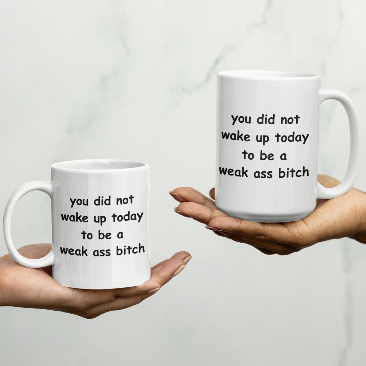 White 11 & 15oz ceramic coffee mug with a motivational and bold message printed in playful, rounded black font. The text reads: “You did not wake up today to be a weak ass bitch.” Designed to inspire confidence and a no-nonsense attitude, this mug is perfect for anyone who loves starting their day with a strong dose of motivation and humor. The glossy finish gives it a clean, polished look, while the sturdy handle ensures a comfortable grip. Ideal for coffee, tea, or gifting to badass friends!