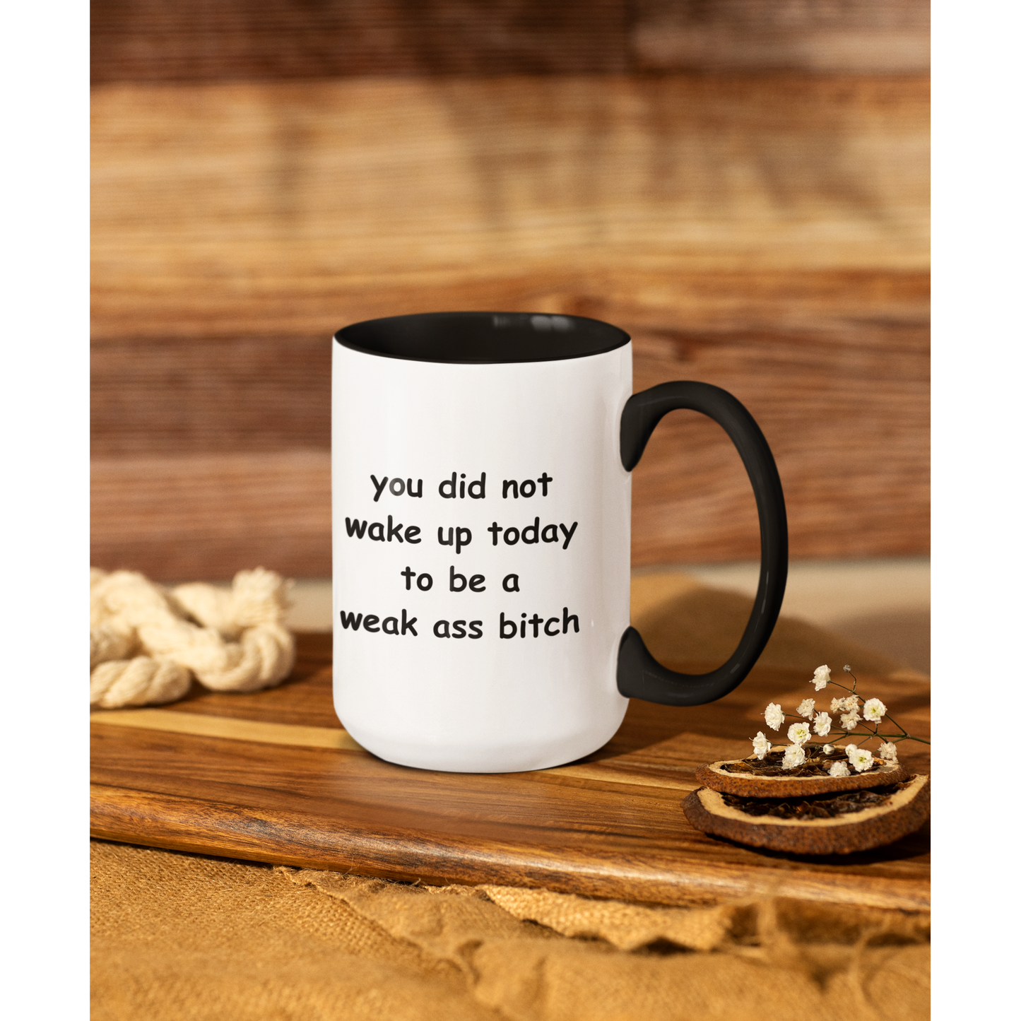 Stylish 15 oz two-tone ceramic coffee mug featuring a bold motivational message printed in playful black text. The phrase reads, “you did not wake up today to be a weak ass bitch,” inspiring confidence and a go-getter mindset with every sip. The mug has a sleek black handle and interior, contrasting sharply with the glossy white exterior for a modern look. Perfect for morning coffee, tea, or as a fun, empowering gift for friends who love a little sass with their caffeine fix.