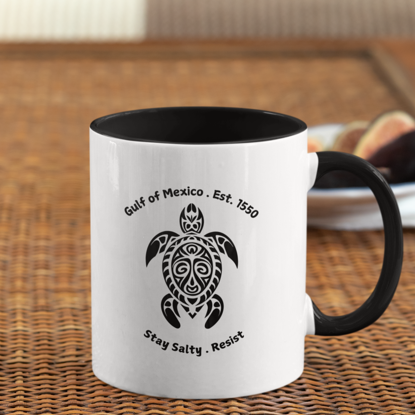 11 oz White ceramic coffee mug with a glossy black handle and interior, featuring a bold tribal-style sea turtle design in black. Above the turtle, the text reads “Gulf of Mexico · Est. 1550” and below, “Stay Salty · Resist.” Perfect for ocean lovers, activists, or anyone drawn to coastal vibes and resilient spirit. The unique turtle artwork adds a cultural, eco-conscious touch, making it an ideal gift or personal keepsake.