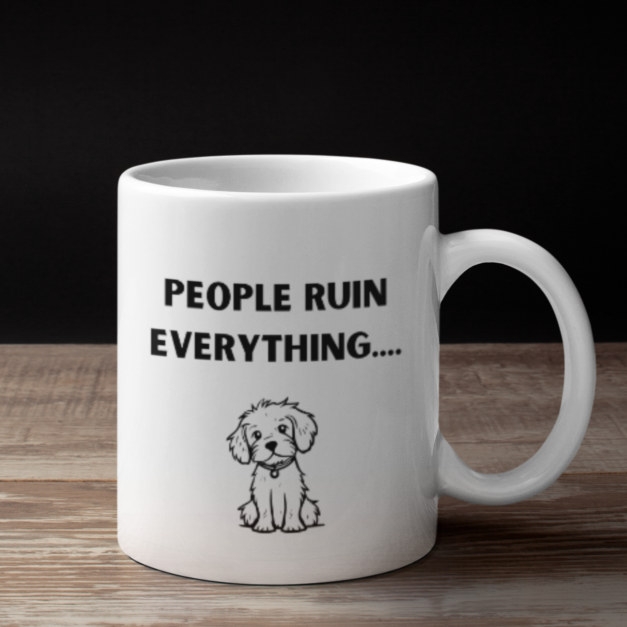 11 oz white ceramic coffee mug featuring a humorous and relatable design perfect for dog lovers and introverts alike. The front showcases bold black text that reads “PEOPLE RUIN EVERYTHING….” above an adorable hand-drawn illustration of a cute, fluffy puppy sitting down with a sweet expression. The contrast between the playful puppy graphic and the sarcastic phrase adds charm and personality.