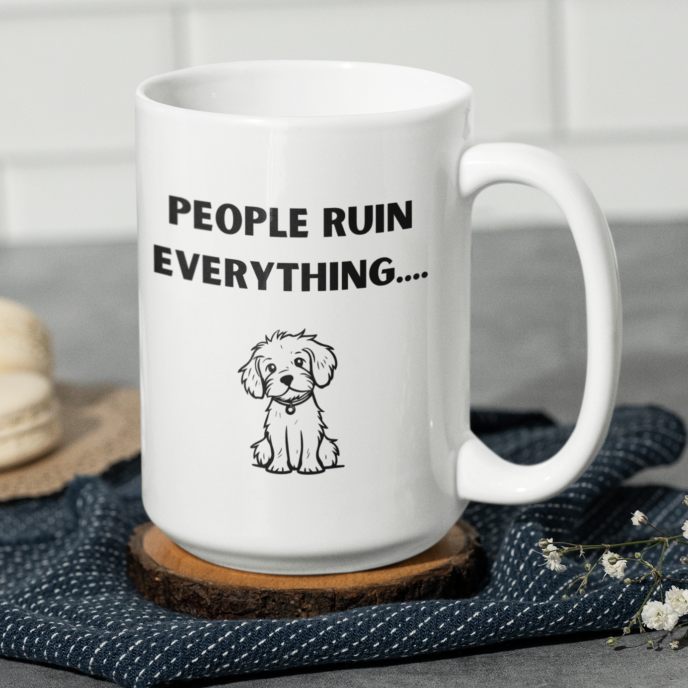 15 oz white ceramic coffee mug featuring a humorous and relatable design perfect for dog lovers and introverts alike. The front showcases bold black text that reads “PEOPLE RUIN EVERYTHING….” above an adorable hand-drawn illustration of a cute, fluffy puppy sitting down with a sweet expression. The contrast between the playful puppy graphic and the sarcastic phrase adds charm and personality.