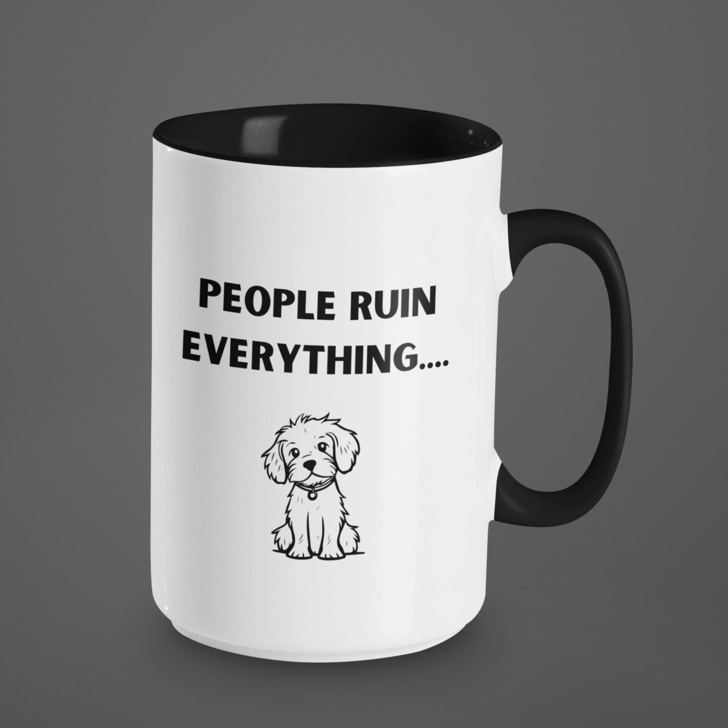 15 oz ceramic coffee mug featuring a humorous and relatable design. The exterior is glossy white with a black handle and black interior for a sleek, modern contrast. Printed on the front is the phrase "PEOPLE RUIN EVERYTHING...." in bold, playful black font. Below the text is an adorable illustration of a small, scruffy dog with a sweet, innocent expression, adding charm and humor to the message.