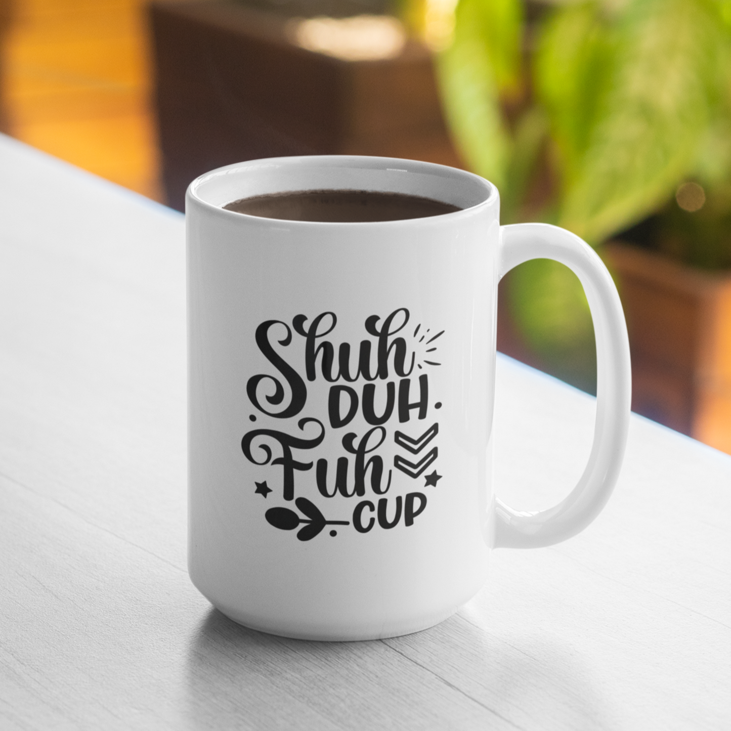 White ceramic coffee mug featuring a bold and cheeky black design that reads, “Shuh Duh Fuh Cup” in a playful script and block font mix, with whimsical accents like arrows, stars, and leaves. Perfect for anyone with a sarcastic sense of humor, this mug makes a great gift or daily dose of sass for coffee lovers. Durable, microwave and dishwasher safe.