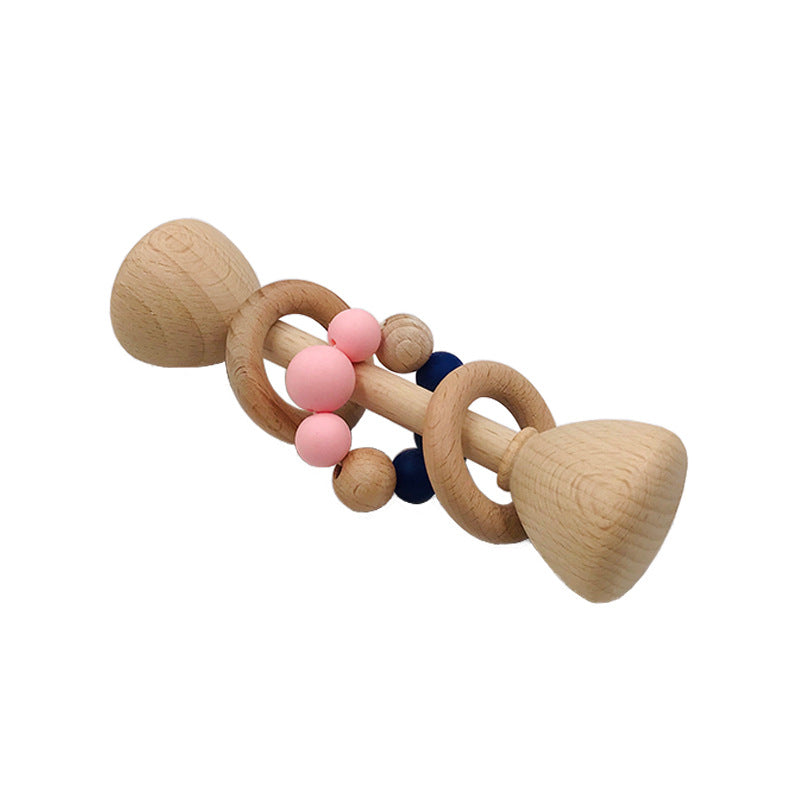 long rattle shaped like barbell with 2 wooden rings on the center handle and one with pink and blue beads