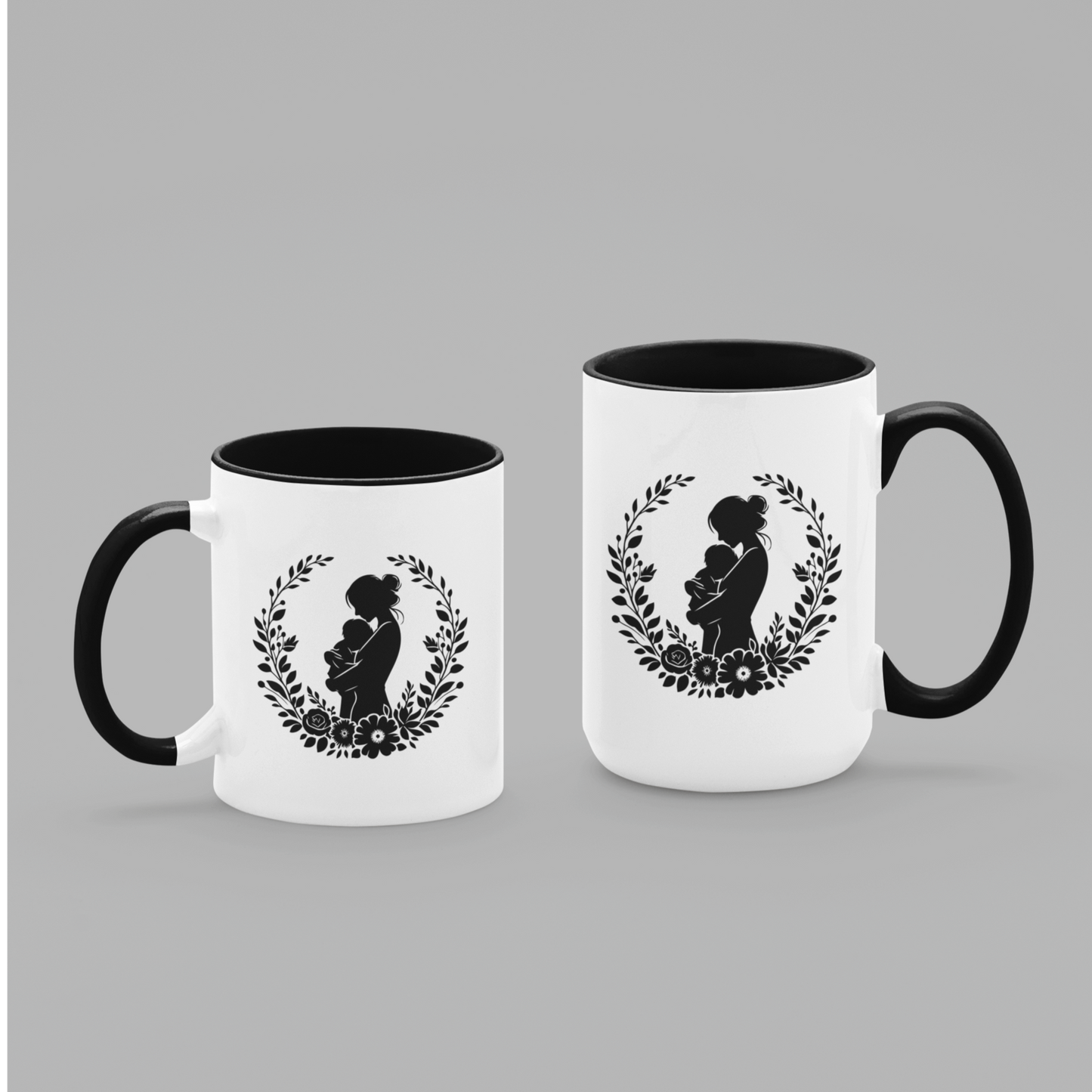 Beautiful white ceramic mug with a black interior and handle, showcasing a heartfelt silhouette design of a mother lovingly holding her baby, surrounded by a delicate floral wreath. This mug is perfect for celebrating motherhood. Ideal as a thoughtful gift for new moms, Mother’s Day, or baby showers. Microwave and dishwasher safe, this mug combines warmth, style, and durability for everyday use.