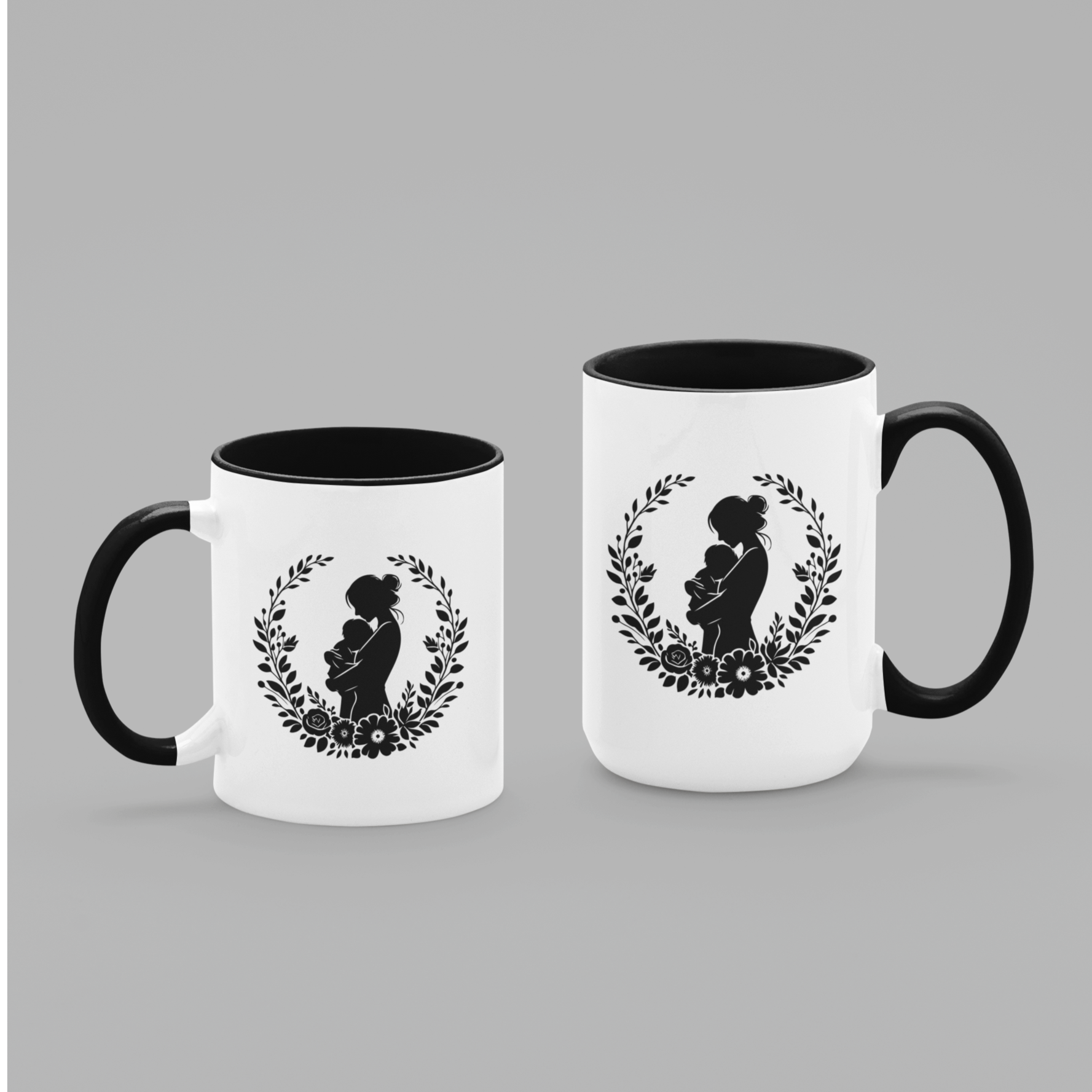 Beautiful white ceramic mug with a black interior and handle, showcasing a heartfelt silhouette design of a mother lovingly holding her baby, surrounded by a delicate floral wreath. This mug is perfect for celebrating motherhood. Ideal as a thoughtful gift for new moms, Mother’s Day, or baby showers. Microwave and dishwasher safe, this mug combines warmth, style, and durability for everyday use.