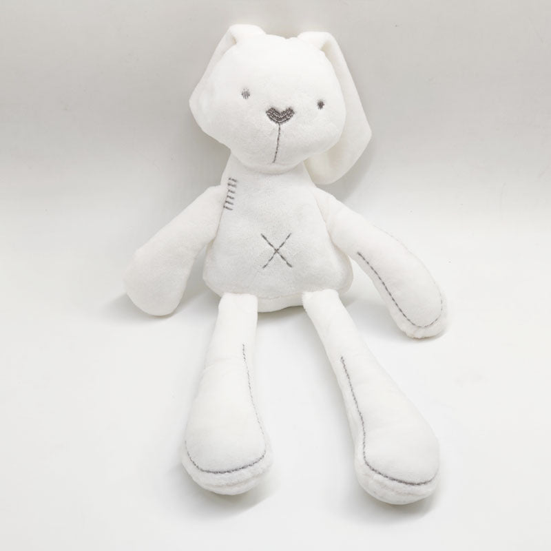 white plush bunny toy with long arms and legs and grey stitching for the nose and eyes and outlines of arms and legs