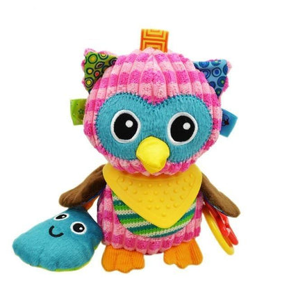 plush owl with pink striped head and body and blue circles around eyes with yellow beak and attached teething ring
