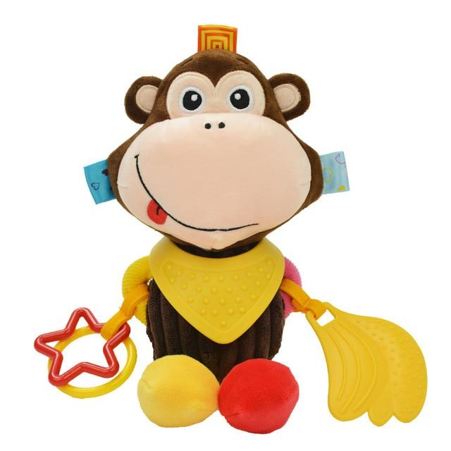 plush monkey toy with brown head and body and peach colored face with red and yellow feet and teething rings attached 