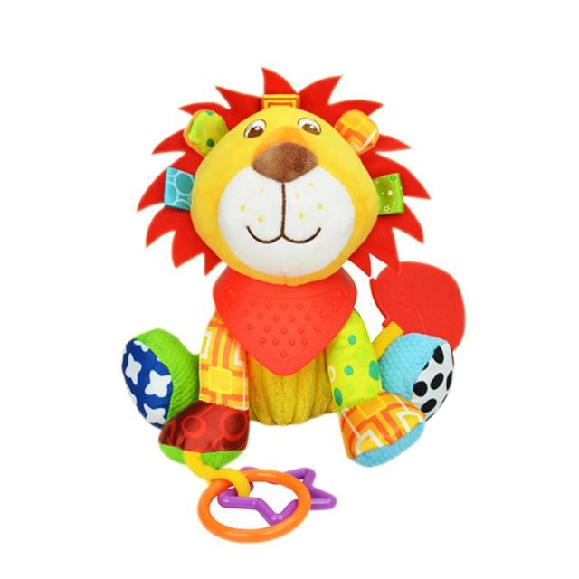 brightly colored plush lion with yellow face and body with orange felt mane and sensory tags attached to the side of his head with multiple fabrics on arms, legs and feet
