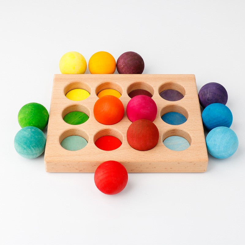 wooden tray with 12 brightly colored wooden balls that can be matched with their corresponding color inside the tray
