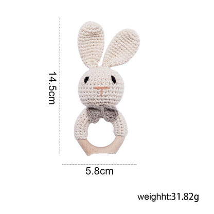 Rabbit crochet teething ring with natural wood handle. Dimensions at 14.5 cm x 5.8 cm