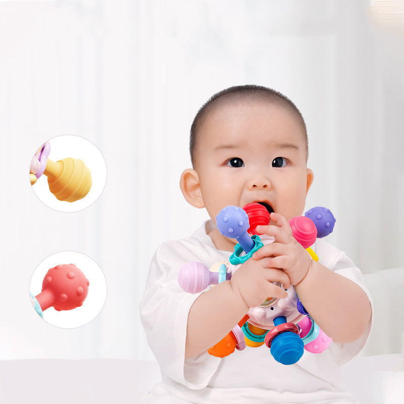 image of baby chewing on sensory ball