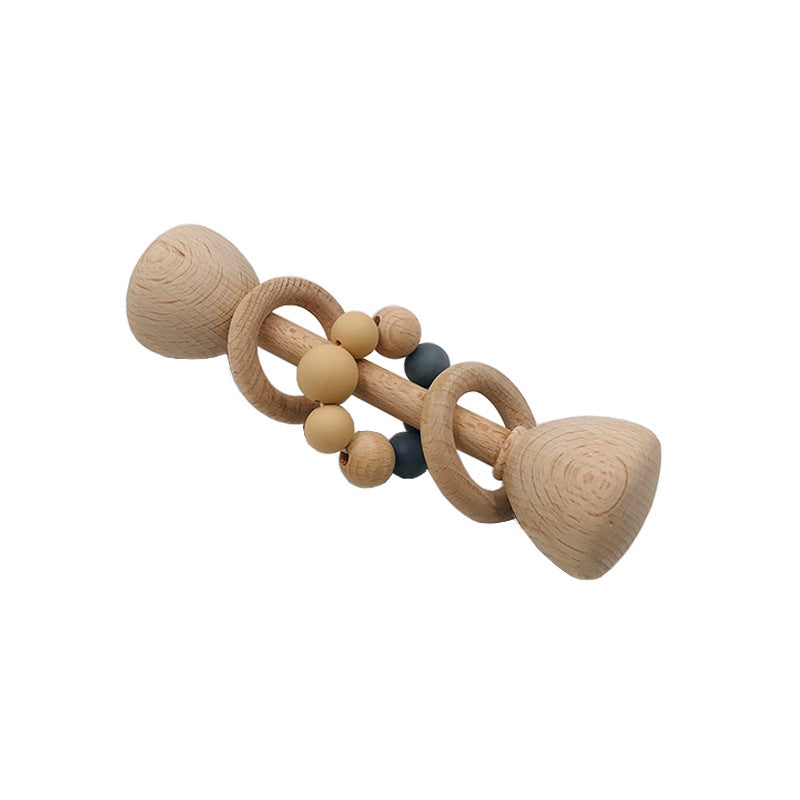 long rattle shaped like barbell with 2 wooden rings on the center handle and one with tan and grey beads