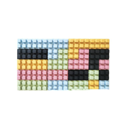 set of 20 blocks in multiple colors including pale blue, gold, light green, light pink and black