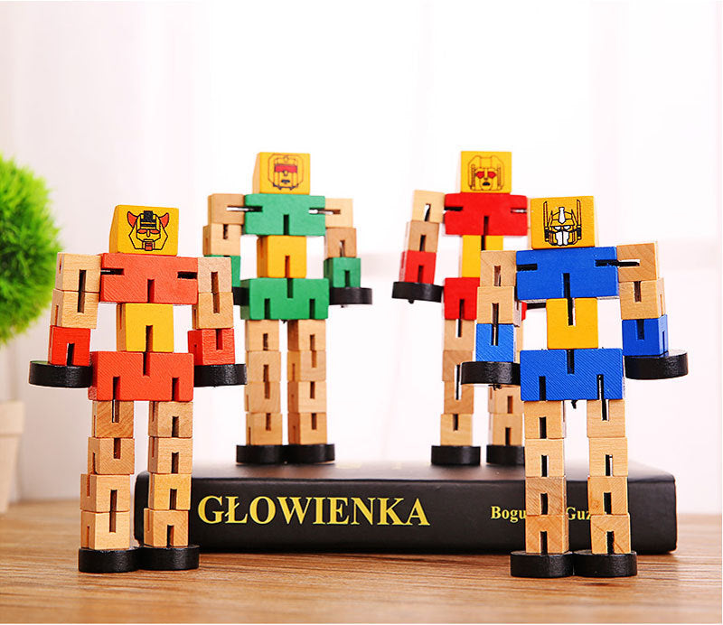 4 wooden robots pictured in a group