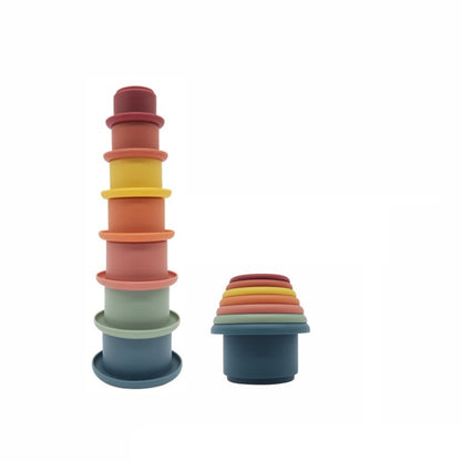 brightly colored silicone cup set stacked on white background