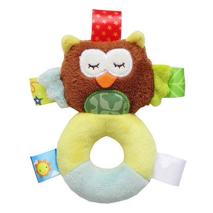 brown, yellow and baby blue plush owl rattle with circular plush handle for the body and multicolor sensory tags attached