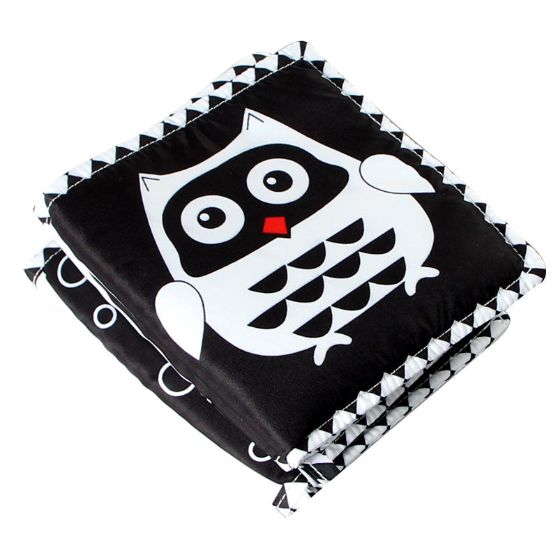 black and white crib mount folded with owl image on outside