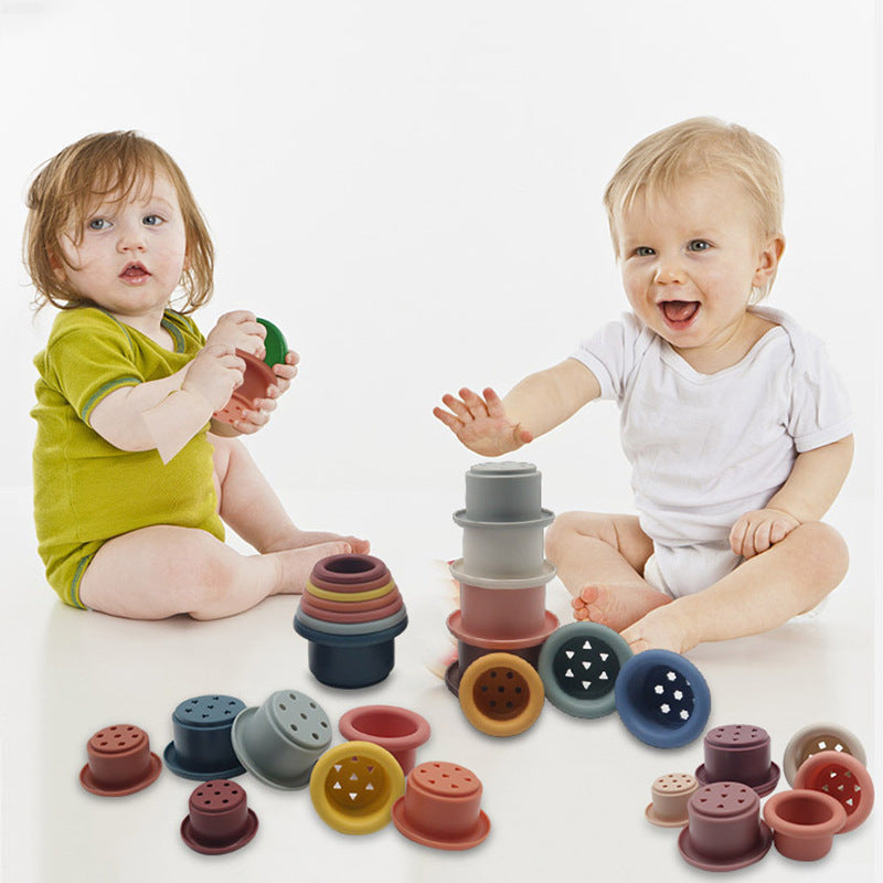 2 babies playing with 2 sets of cups
