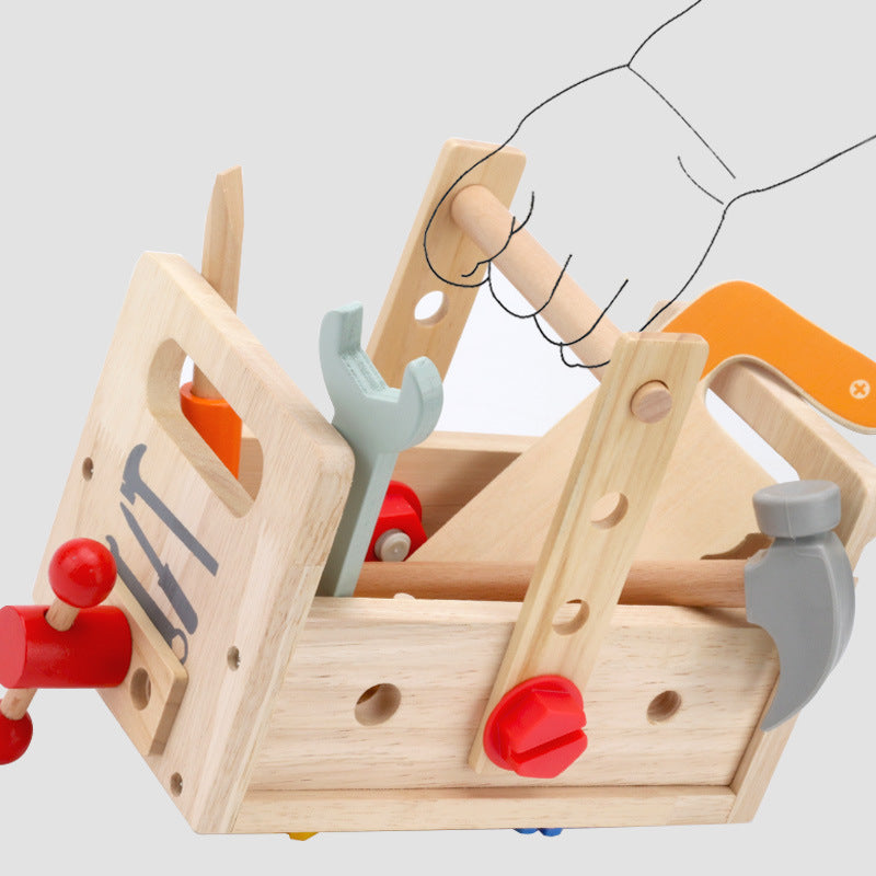 image of wooden tool box with accessories being carried by  a small hand holding the handle
