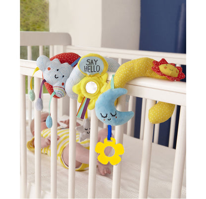 image of infant in crib with spiral wrap attached to the rail of the crib