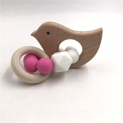 bird teether natural wood with pink and white beads