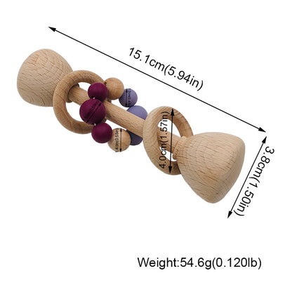 long rattle shaped like barbell with 2 wooden rings on the center handle and one with maroon and purple beads with dimensions of 15.1 cm x 3.8 cm