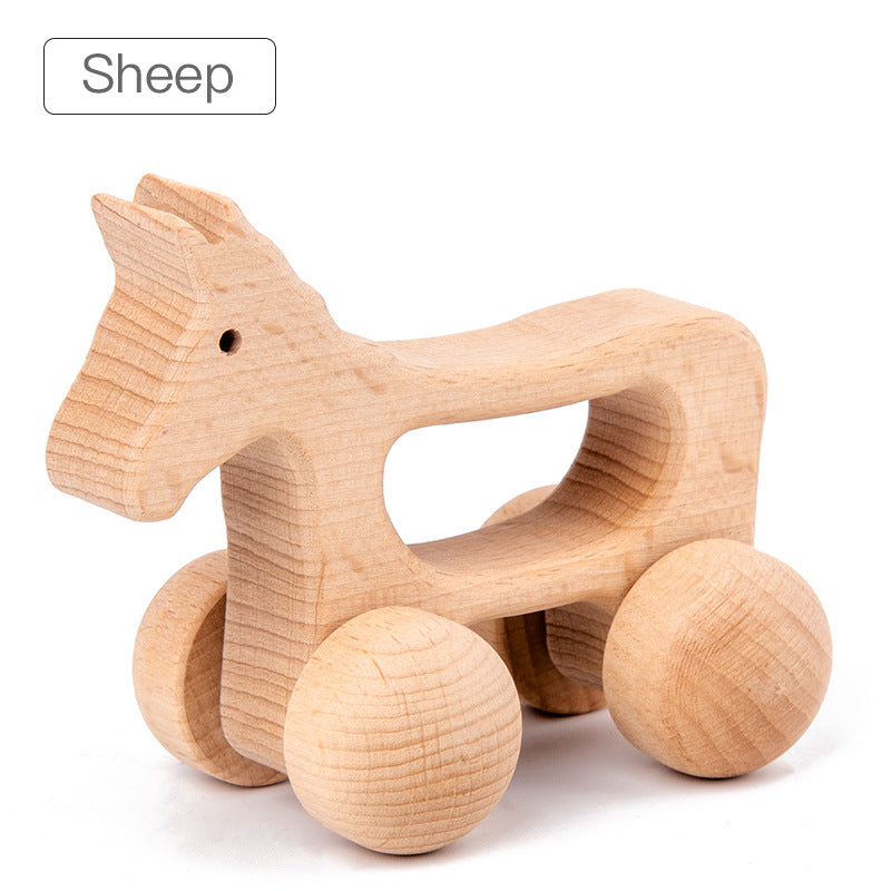 sheep rolling animal toy with natural wood and large round wheels. opening in center of toy for gripping